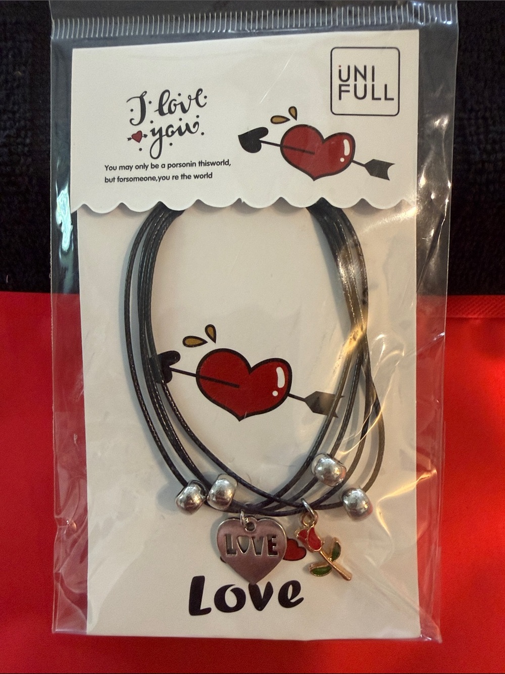 UNIF Black Multi-Strand Cord Bracelet with 'LOVE' Heart and Rose Charms